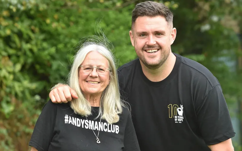 Elaine Roberts, in an #AndysManClub T-shirt, and Luke Ambler standing together outdoors.